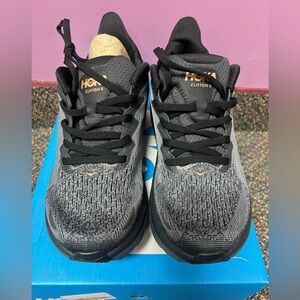 New - Hoka W Clifton 8 - Dark Grey Primary - Black & Gold accents - size 7B